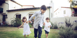 Children Running in front of house